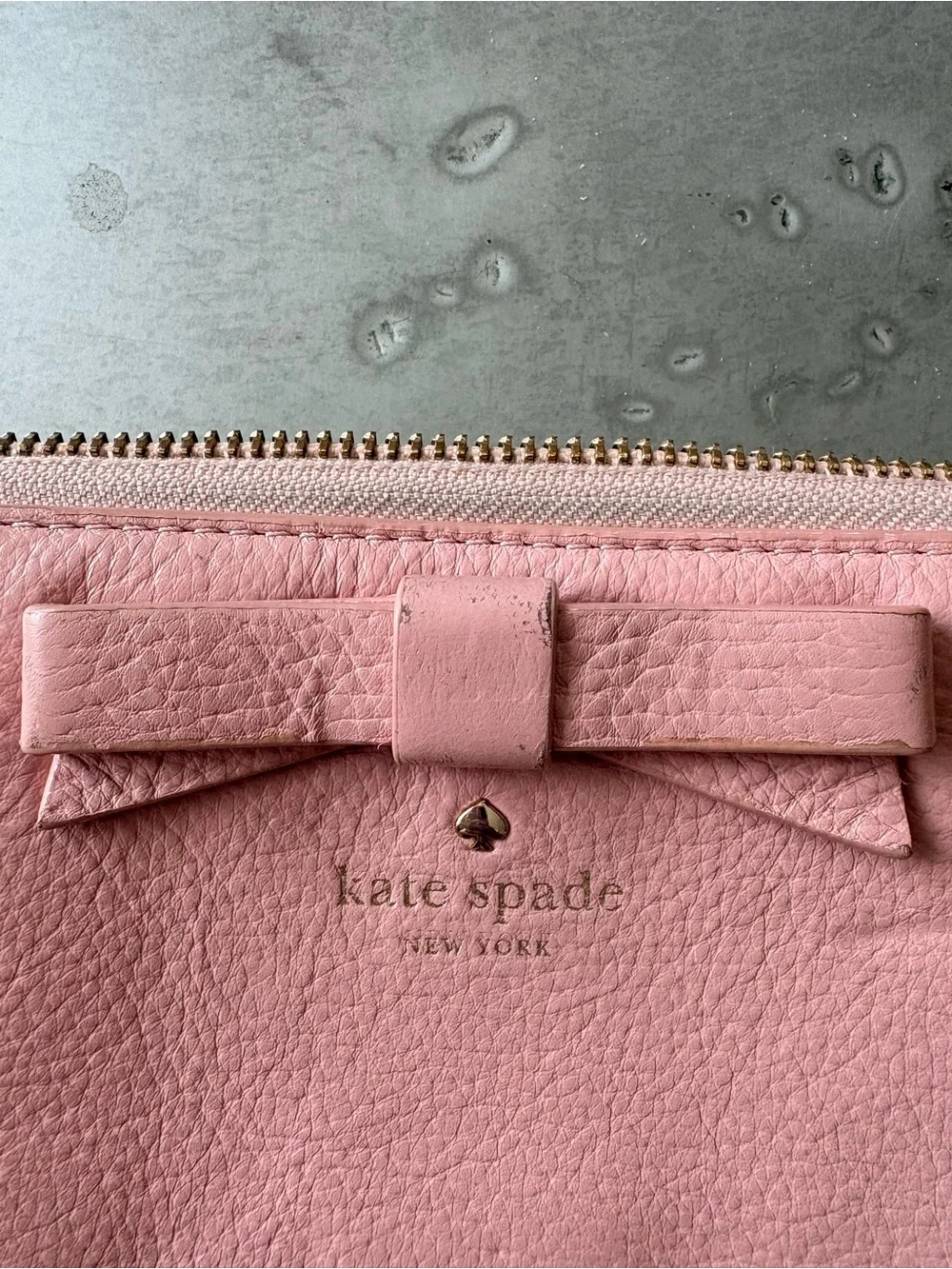 kate spade pink pebbled leather zip wallet with bow